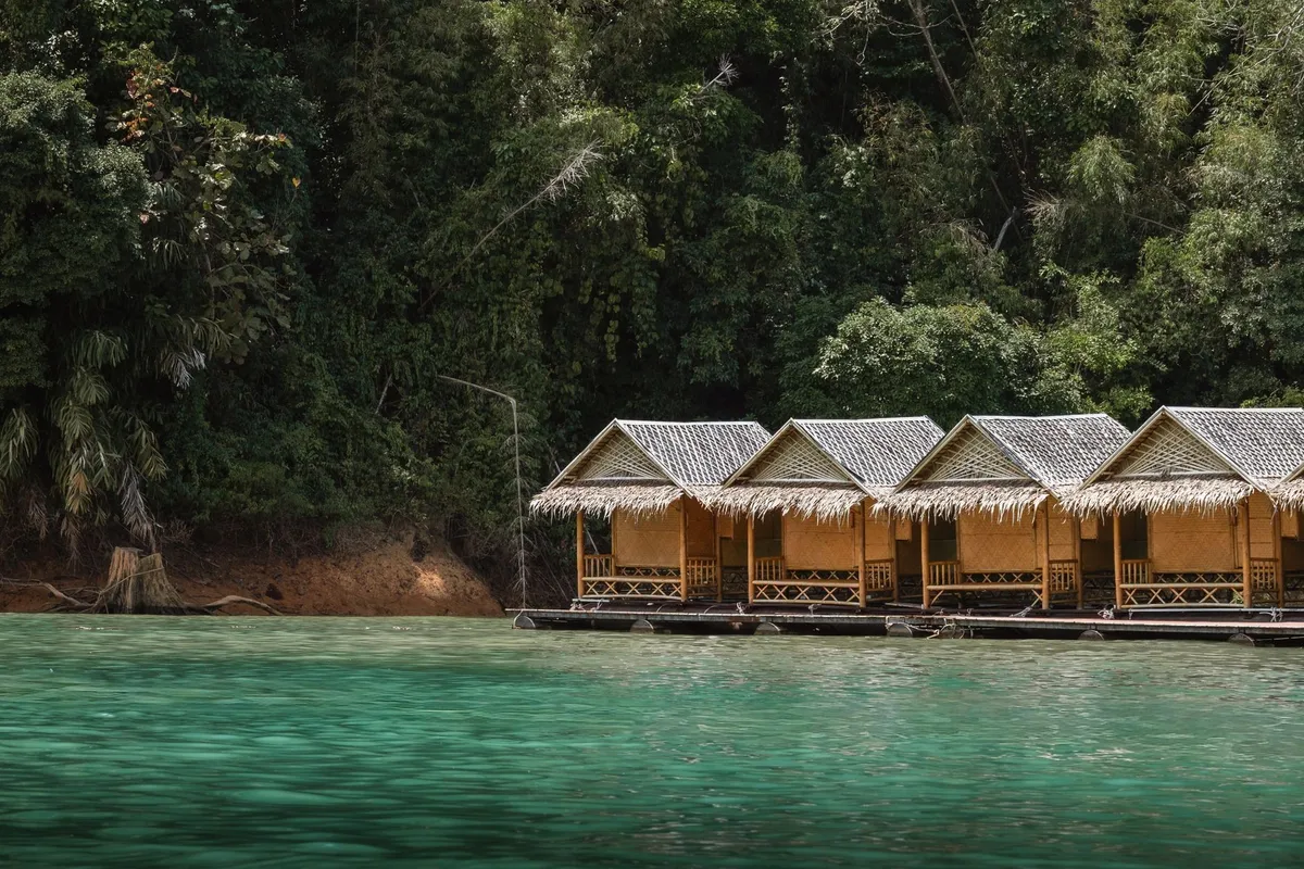 Floating eco-lodge cabins moored on a forest lake